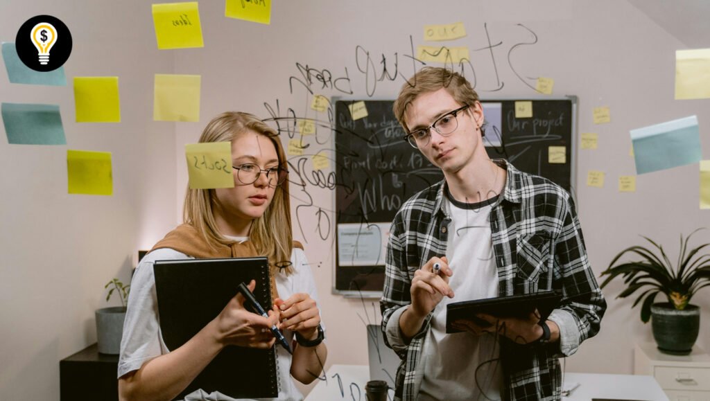 Two young entrepreneurs planning strategies to level up their business